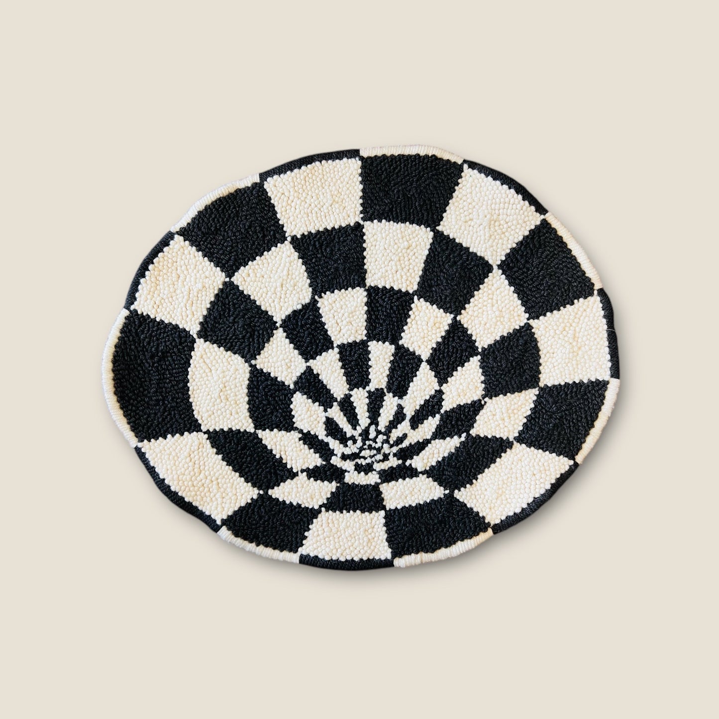 punch needle checkered rug that looks like you're looking down a tunnel