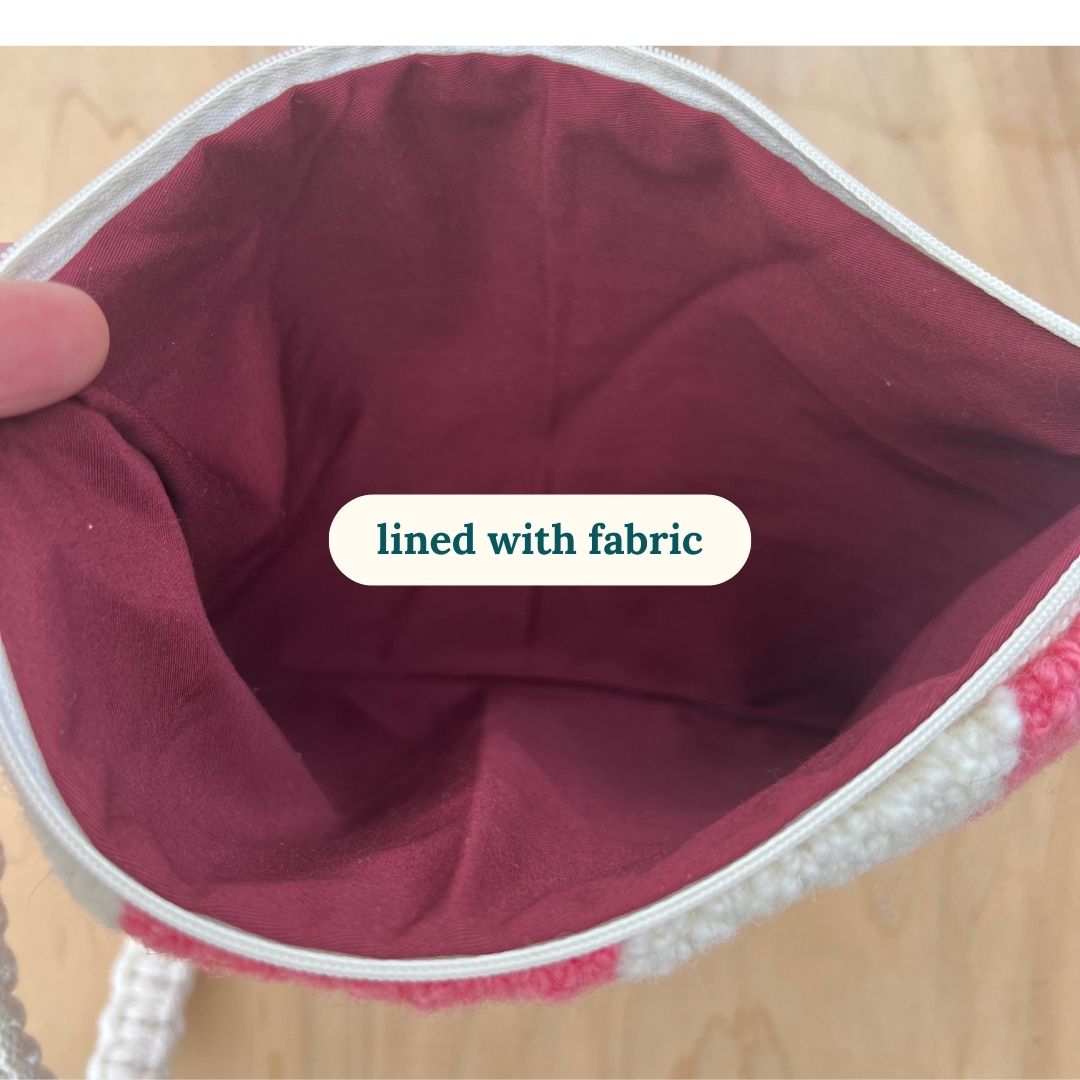 inside is lined with maroon fabric