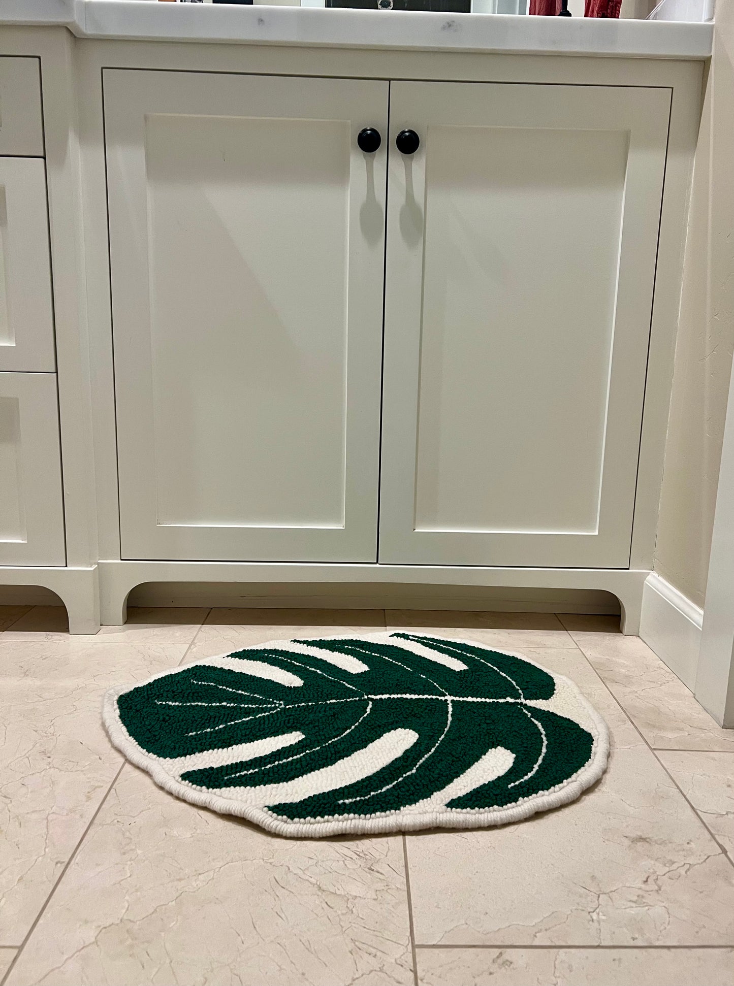 another view of rug in bathroom next to sink