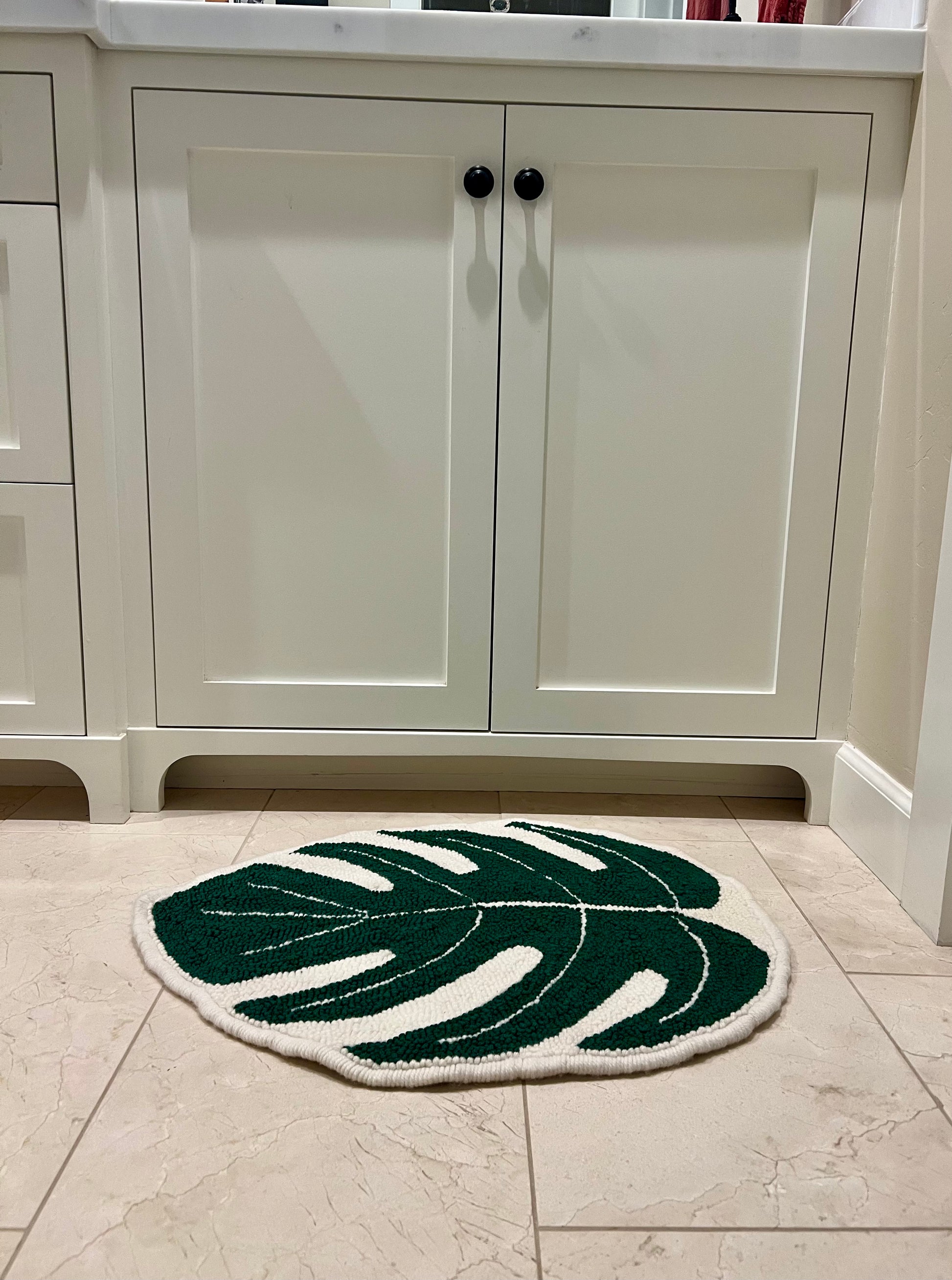 another view of rug in bathroom next to sink