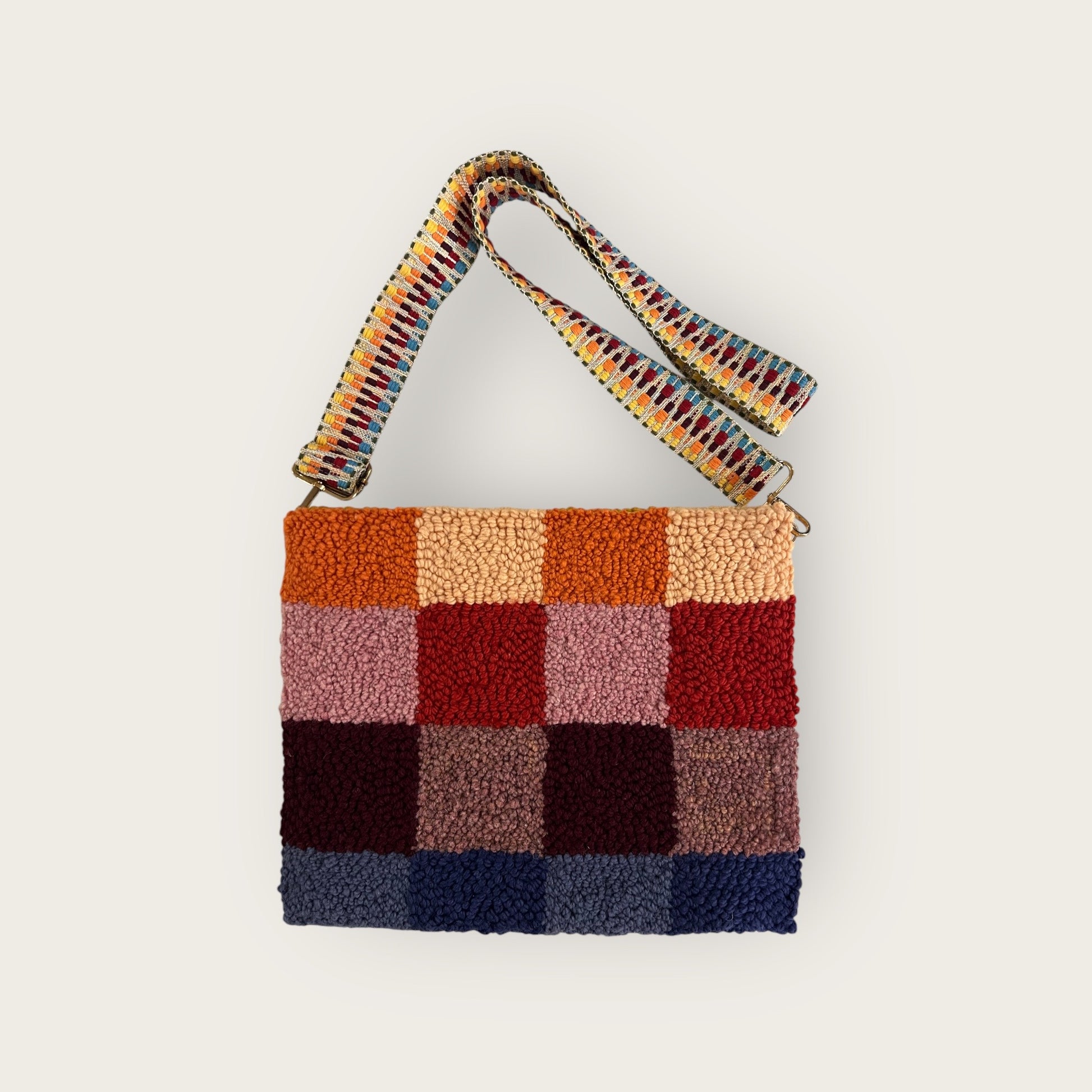 this side is made from 2 shades of orange, pink/red; 2 shades of maroon; 2 shades of purple wool