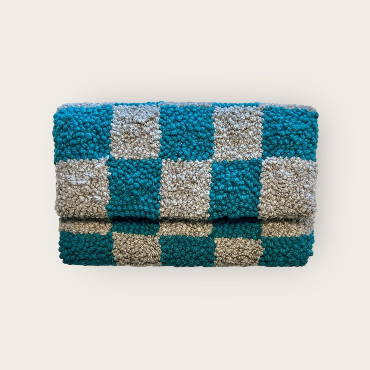 turquoise and grey wool checkered design on clutch