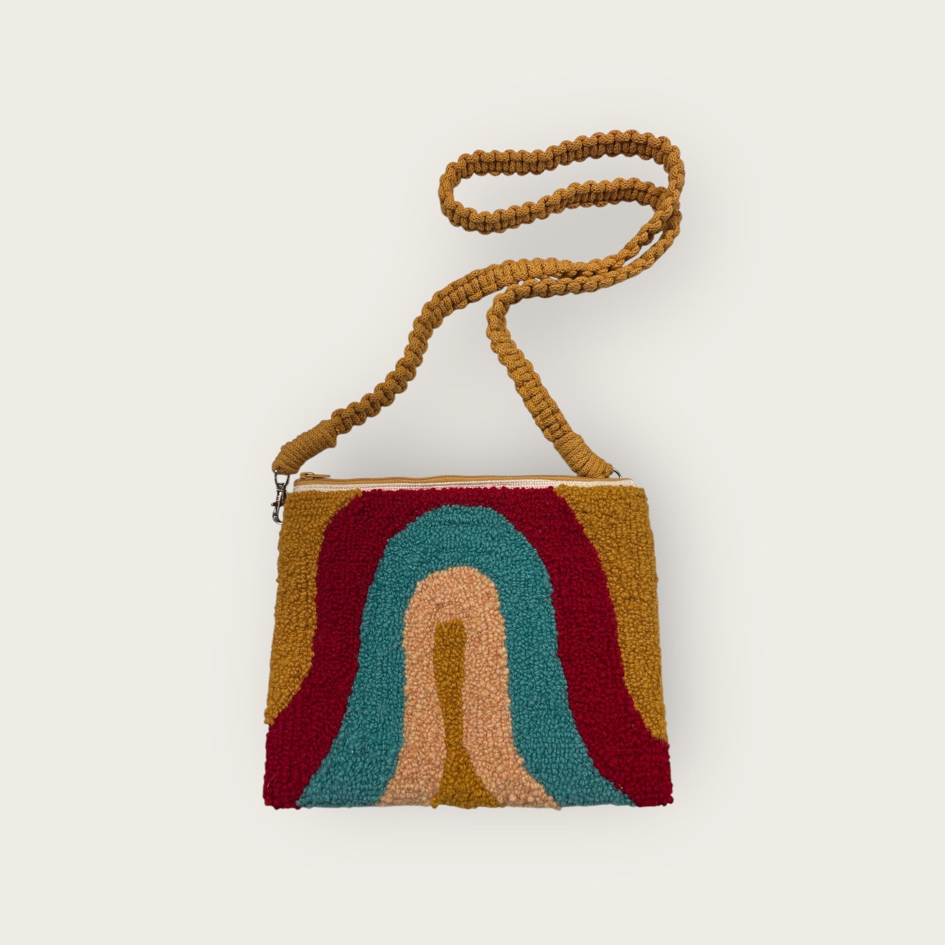 made with wool in mustard, red, turquoise and light yellow/orange