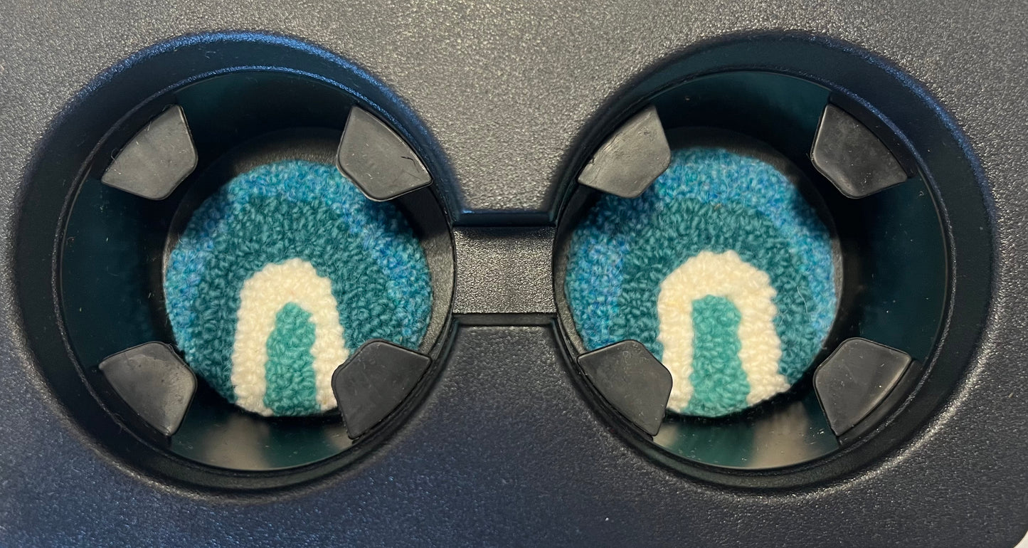 View of coasters in the cup holder of a car
